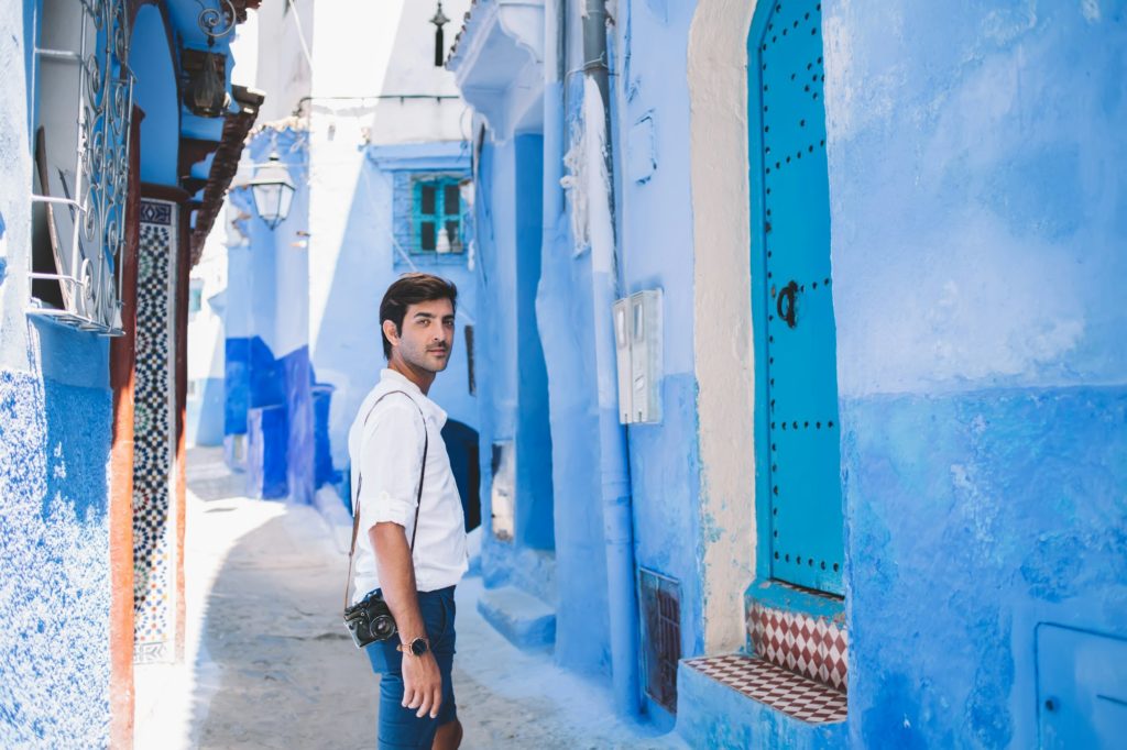 Thoughtful young male tourist visiting famous city in Morocco